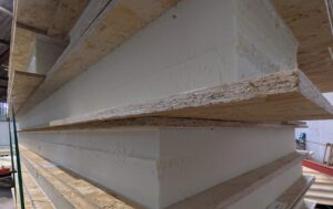Kingspan TEK SIPs panel cross-section showing OSB layers and insulated core for lodge and cabin construction